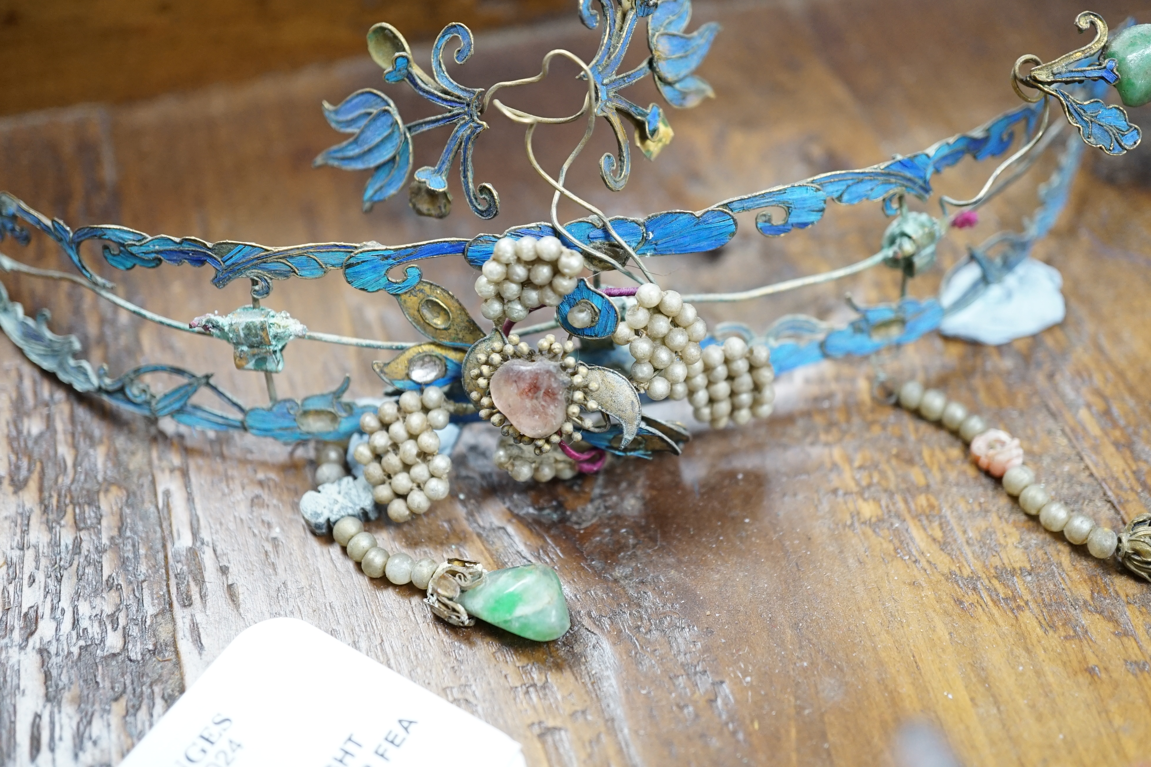 A group of eight Chinese kingfisher feather, jade, seed pearl, coral and hardstone mounted headdresses and ornaments, late Qing dynasty, some losses